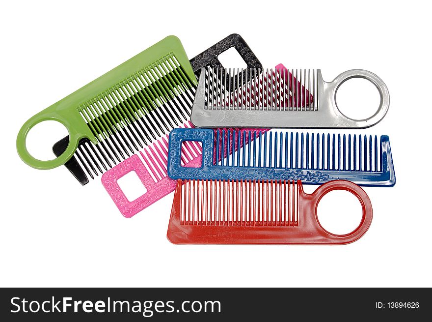 Multi-coloured hairbrushes on a white background