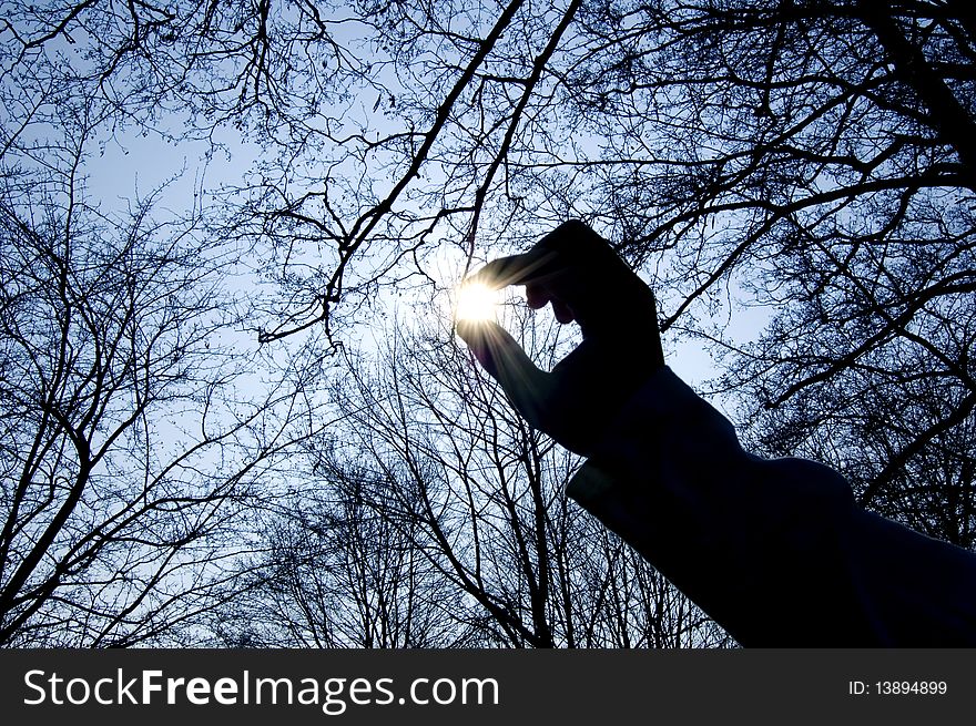 Conception of hand and sun image. Sun in fingers.