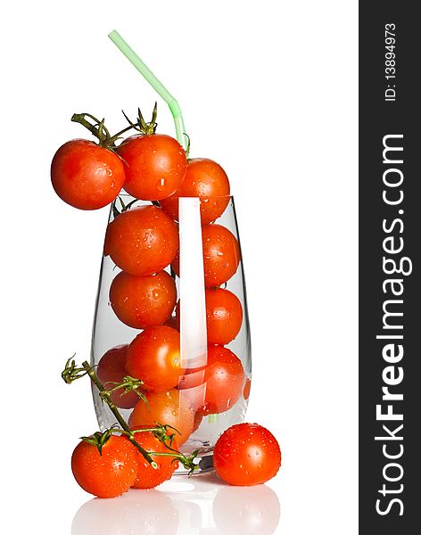 Bunch of tomatoes in a glass with straw. Bunch of tomatoes in a glass with straw