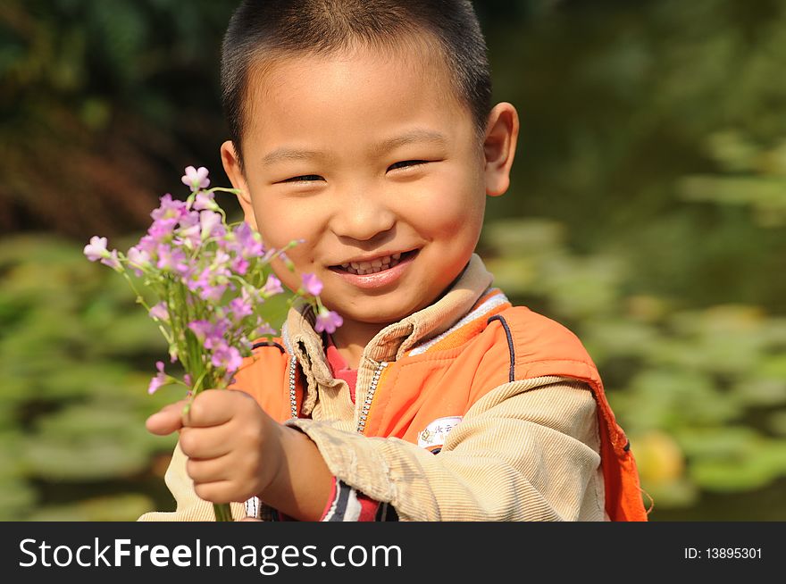 Boy holding flowers