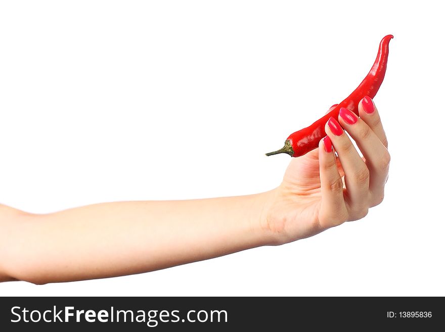 Red pepper in a female hand