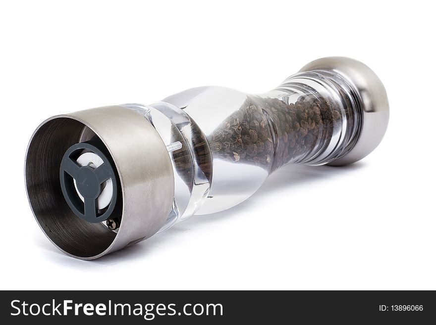 A series. A glass grinder of pepper isolated on a white background