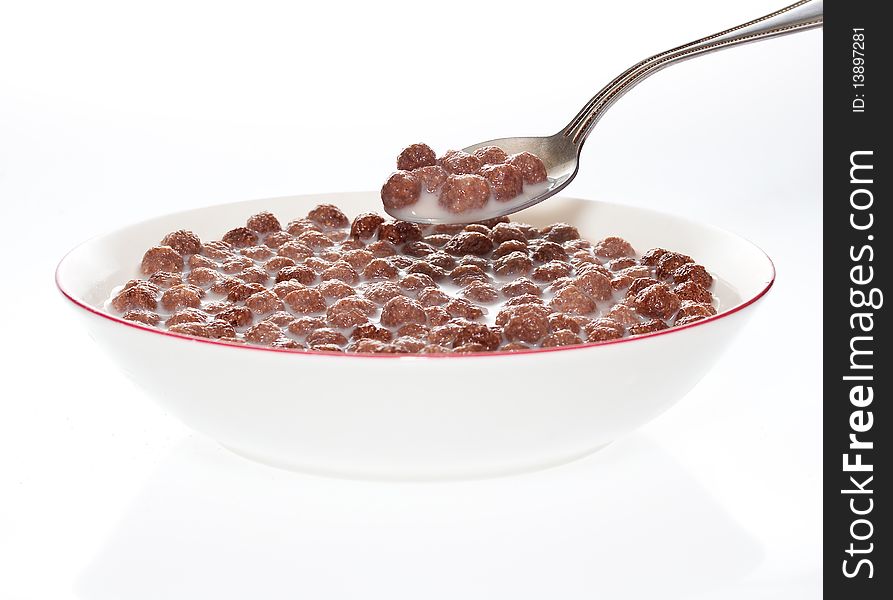 Bowl of milk and chocolate cereal