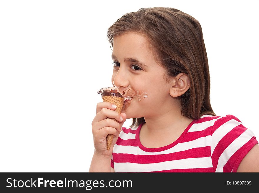 Small girl eating an ice cream cone on a white background
