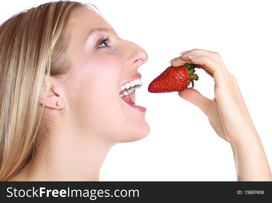 Woman eating strawberry