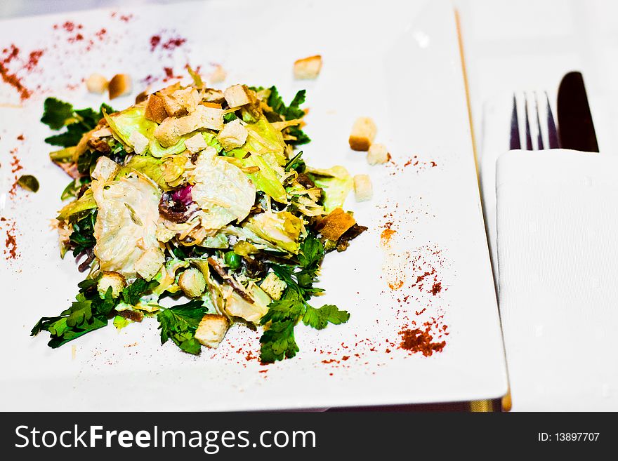 Green salad with meat on a plate