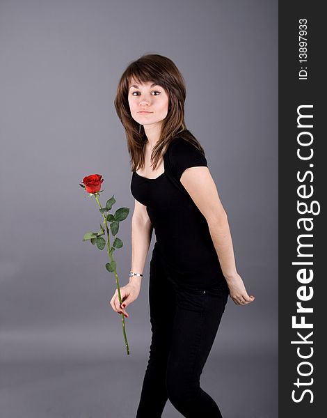 Beautiful girl with rose studio shot