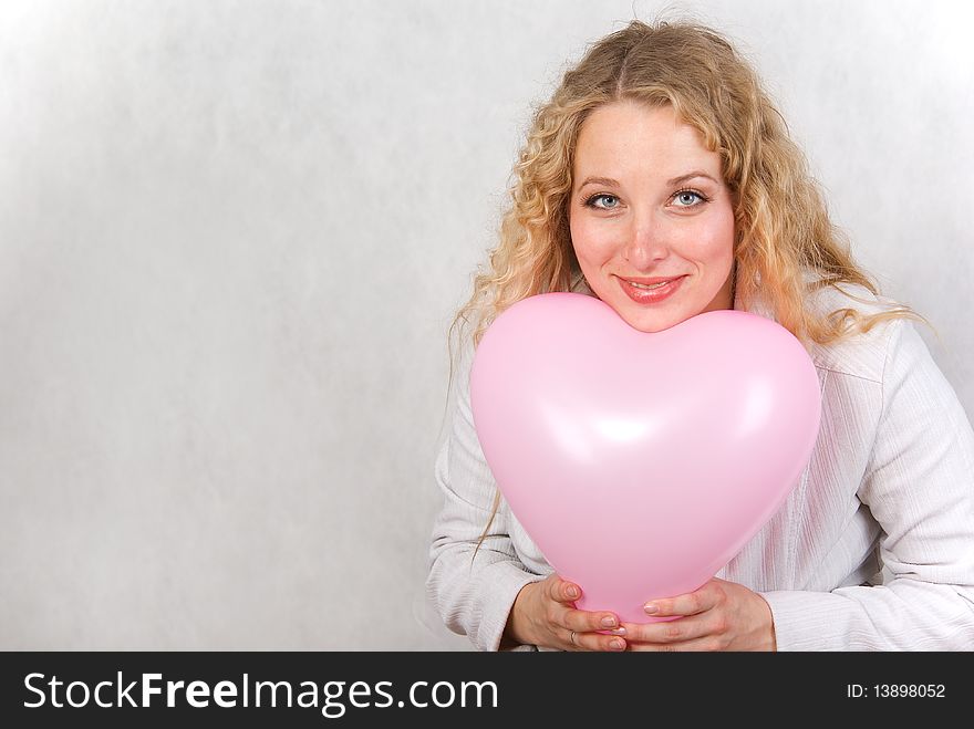 The girl has control over a ball and smiles. The girl has control over a ball and smiles.