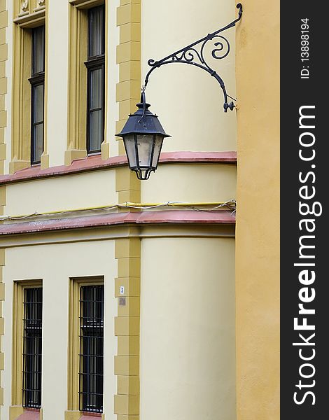 Closeup with street lamp and old building in background. Closeup with street lamp and old building in background