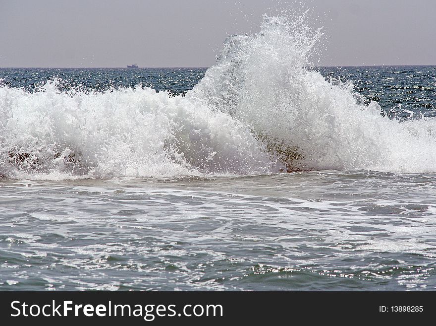 Sea wave and ship on backround. Indian ocean. Sea wave and ship on backround. Indian ocean.