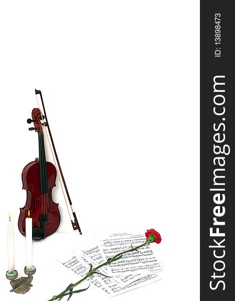 Violin notes with two candles and flower