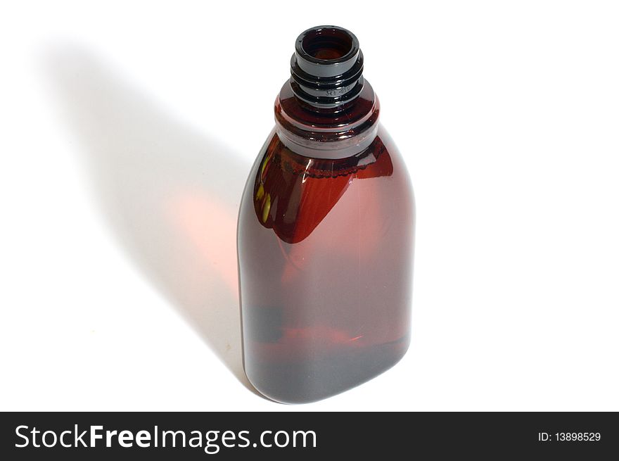 Brown plastic bottle on white background