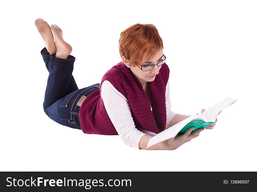 Girl reading book on the floor isolated on white. Girl reading book on the floor isolated on white