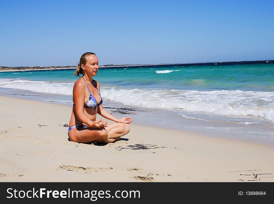 Young beautiful girl on the beach