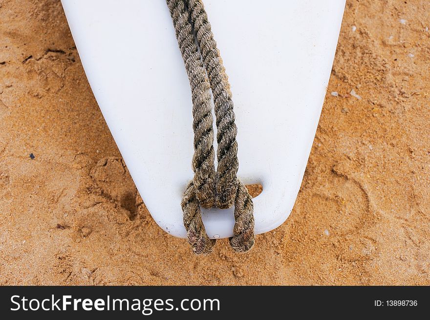 Surfboard on the sand at the beach