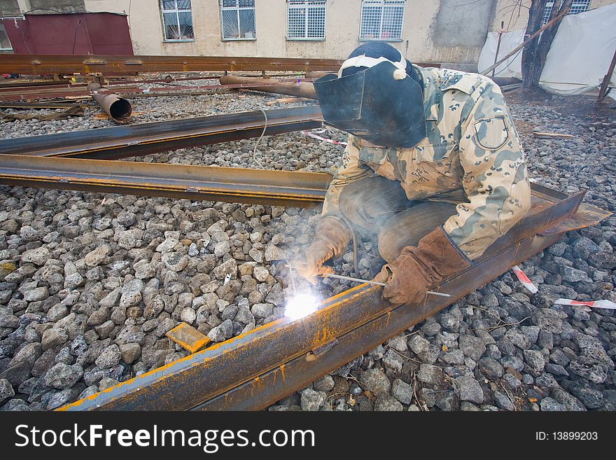 Welder In Mask Welding Construction