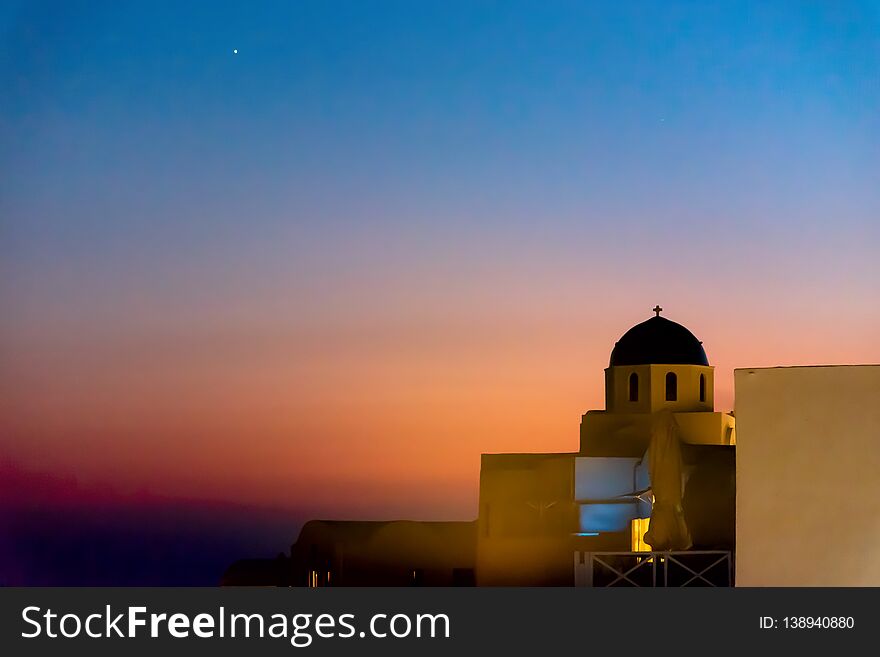 View of Oia village at the sunset - Aegean sea - Santorini island - Greece