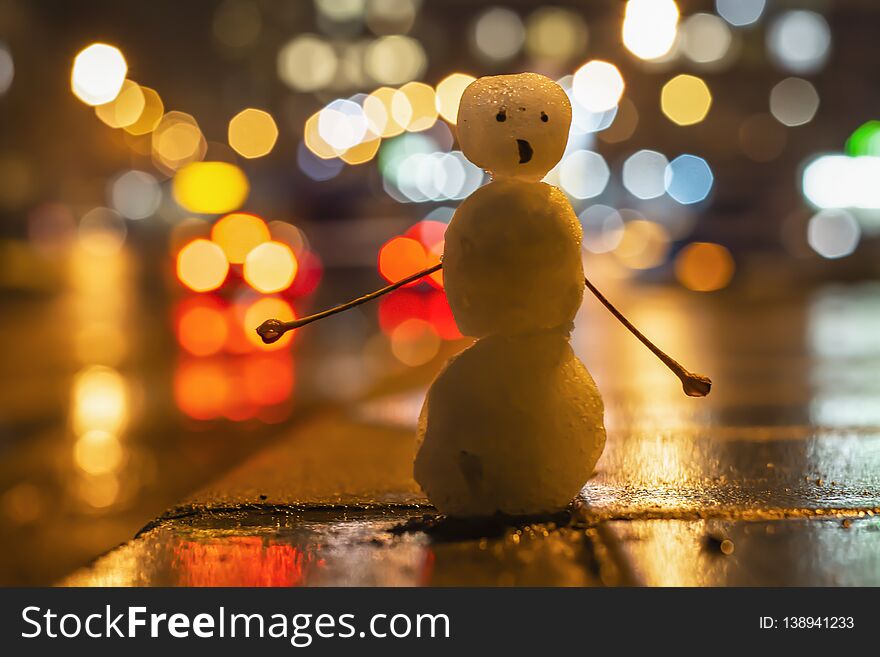 Funny snowman hitchhiker, blurred background. Photo taken in February. Funny snowman hitchhiker, blurred background. Photo taken in February