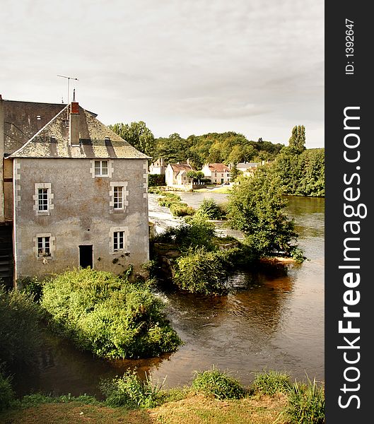 An Historic Mill on the Banks of a River in France. An Historic Mill on the Banks of a River in France