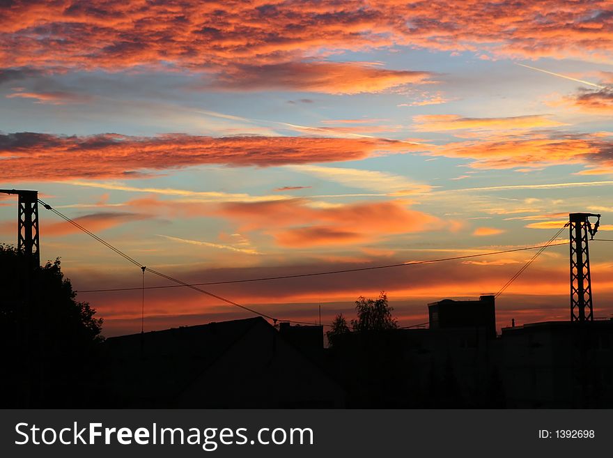 City panorama on a background of the scarlet morning sky