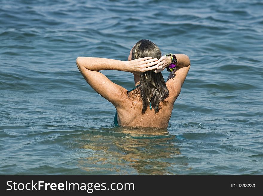The woman bathes in Black sea. The woman bathes in Black sea