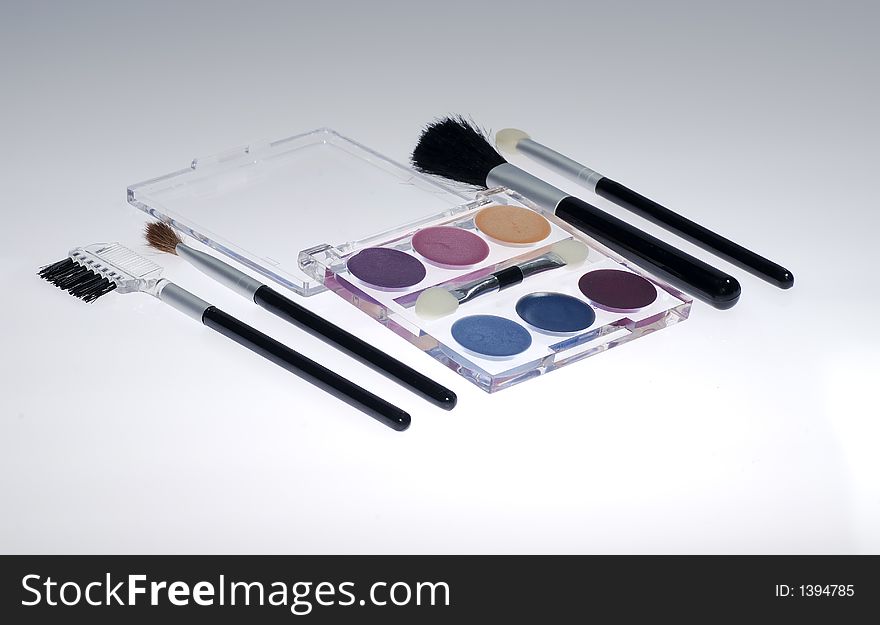 Photo of Eyeliner and Cosmetic Brushes. Photo of Eyeliner and Cosmetic Brushes