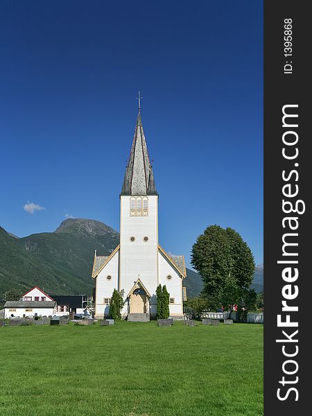 A church in Valldalen, Norway, on a sunny day. A church in Valldalen, Norway, on a sunny day