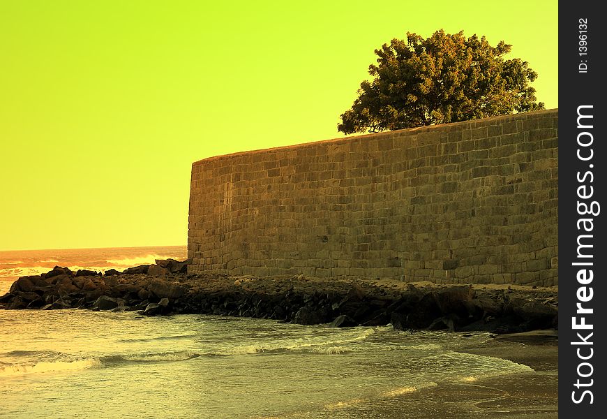Old big stoned wall near a beautiful sea. Old big stoned wall near a beautiful sea.