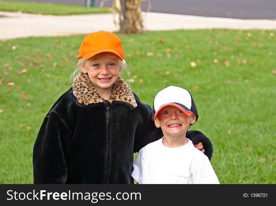 Little brother and sister with hats on. Little brother and sister with hats on