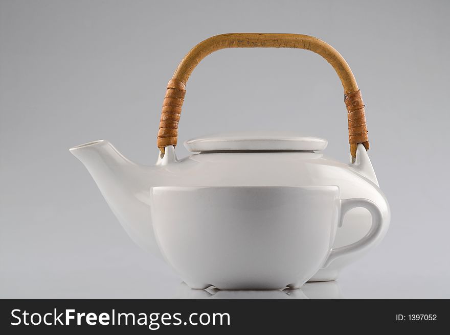 Kettle and cup isolated on white