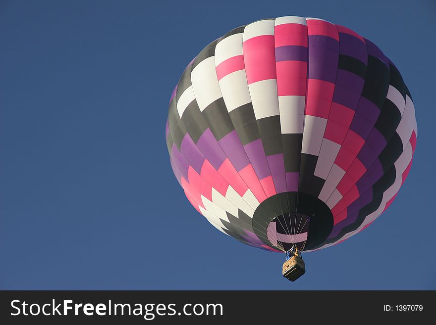 Colorful hot air balloon in clear sky with plenty of room for text. Colorful hot air balloon in clear sky with plenty of room for text