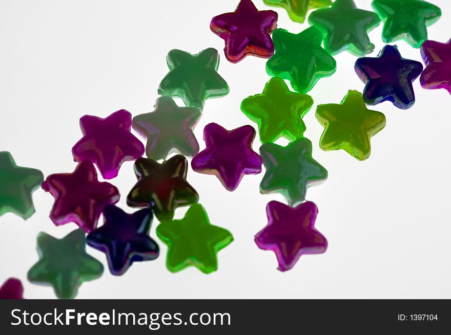 Little coloured stars isolated on white