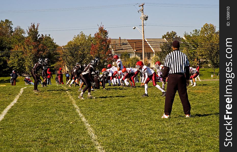 Youth league football game on a Saturday morning in the fall.