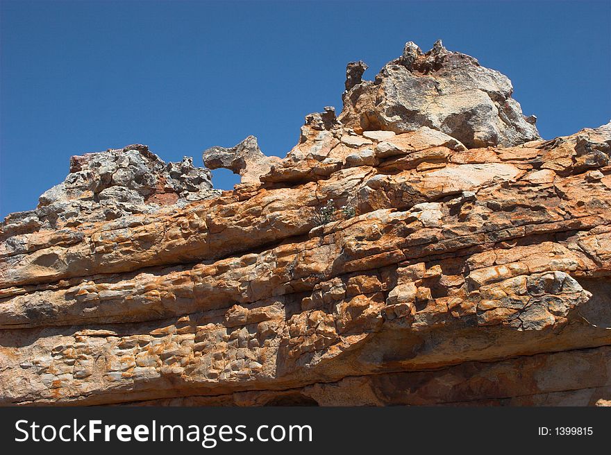 Rare rock formation with deep blue background