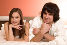 Boy And Girl With Smile On Bed Stock Photo