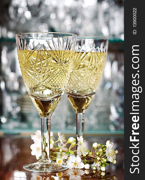 Romantic glasses with white wine and plums branch. Romantic glasses with white wine and plums branch