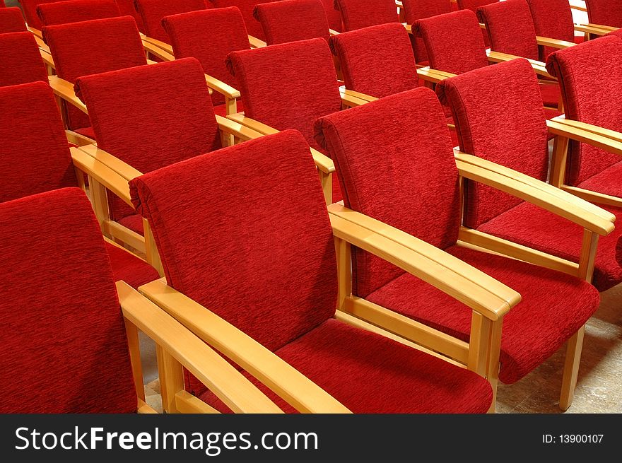 Rows of red chair in auditoriums