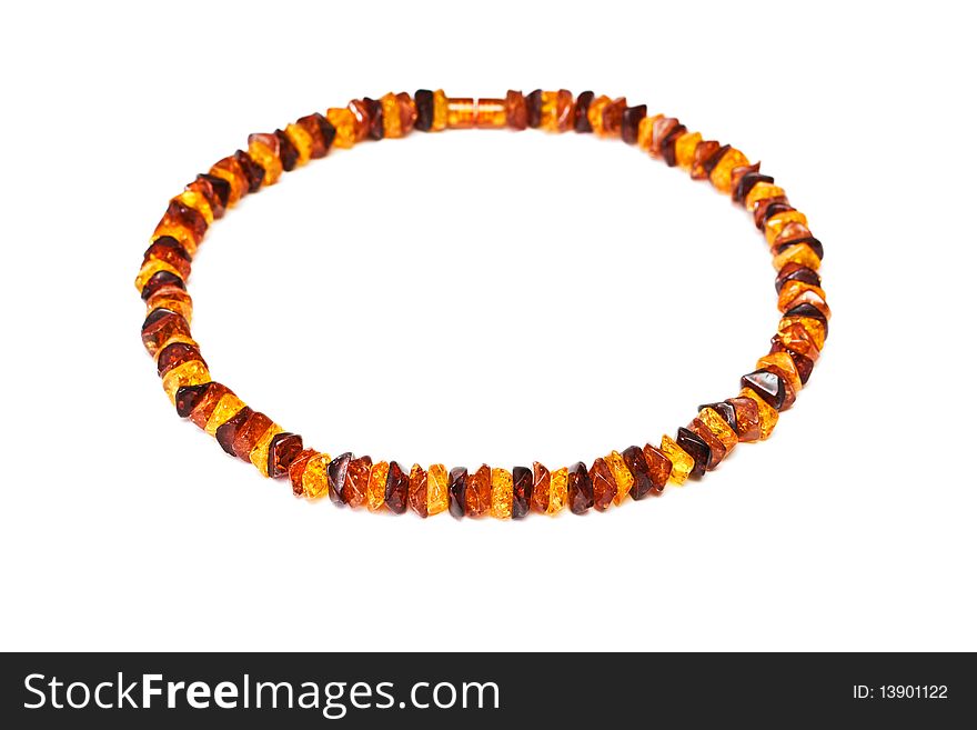 Amber necklace  isolated on a white background. Amber necklace  isolated on a white background.
