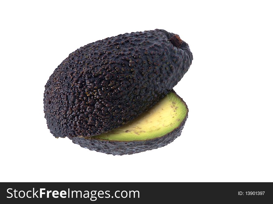 Two half cut avocados against a white background