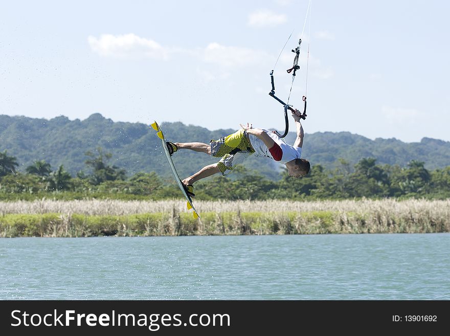 The kiter riding on the river in Dominican Republic. The kiter riding on the river in Dominican Republic