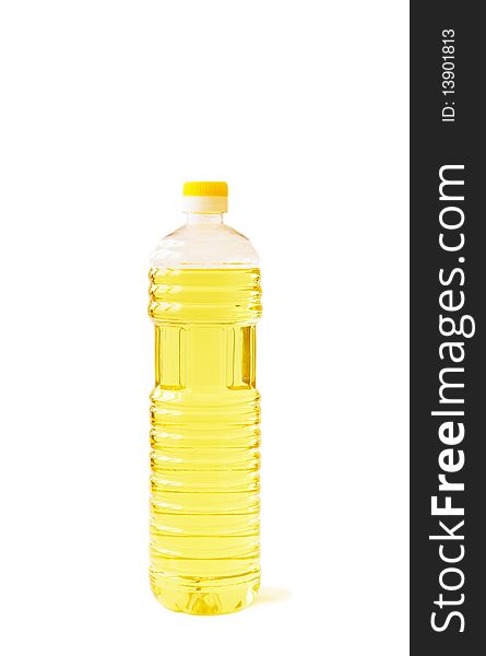 Plastic bottle with vegetable oil on a white background