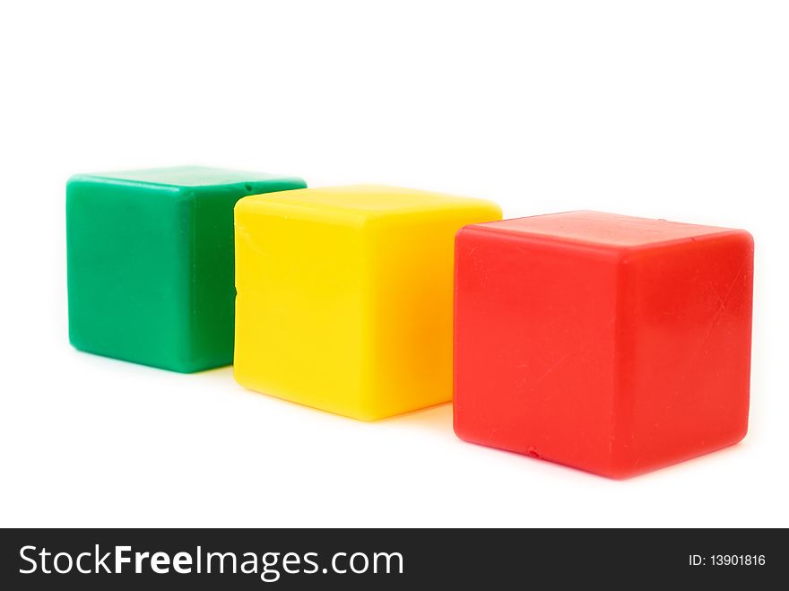 Three color children's cubes on white isolated
