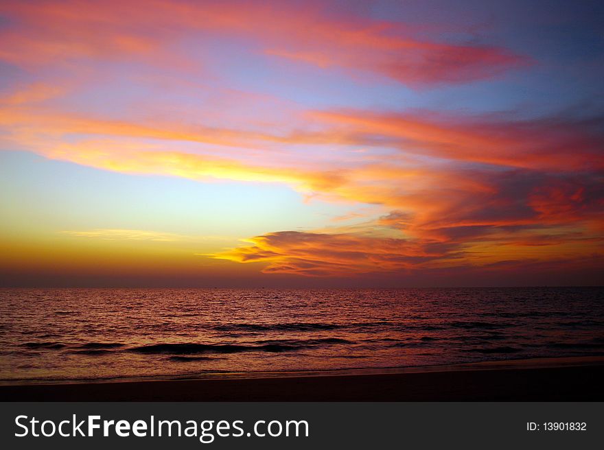 Bright sunset on the seaside. Colorful sky.