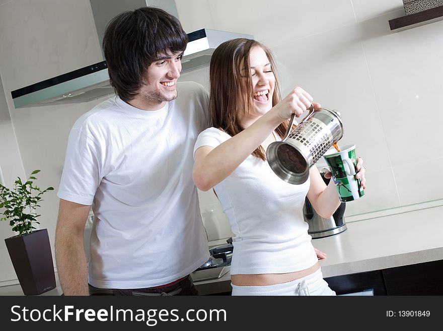 Boy with smile and girl with cup and with teapot. Boy with smile and girl with cup and with teapot