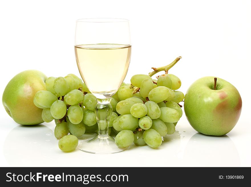 Ripe fruit and wine on a white background