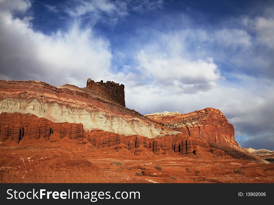 View of the red rock formations in Capitol Reef National Park with blue skyï¿½s and clouds