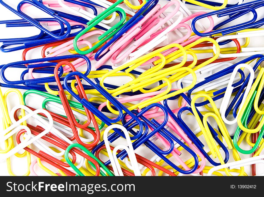 A pile of colorful paper clips isolated on white. A pile of colorful paper clips isolated on white