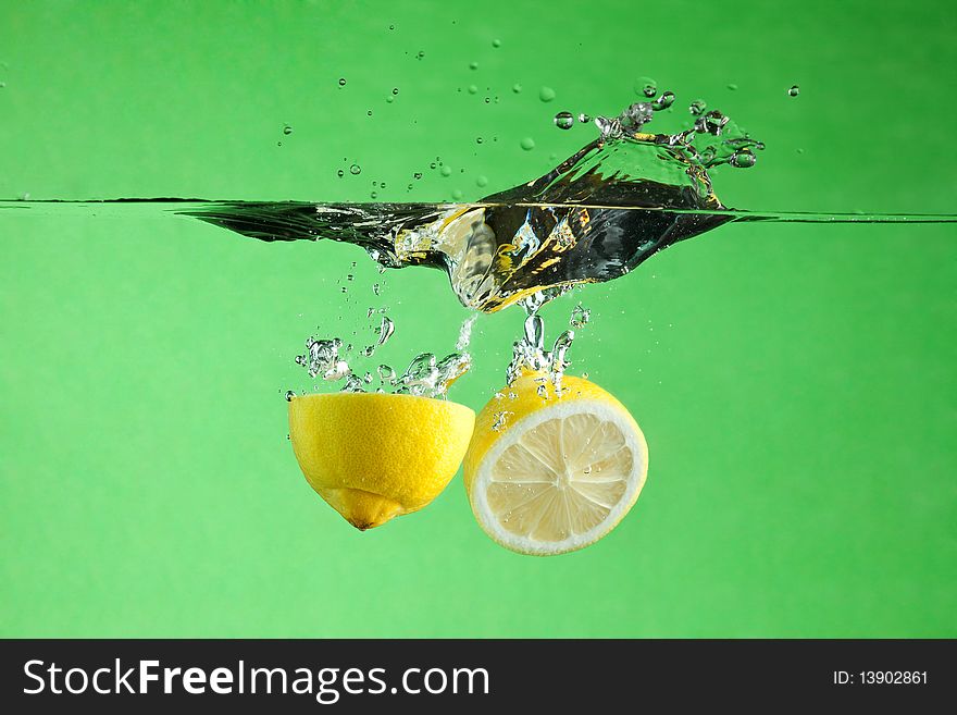 Fresh citrus thrown into the water. Fresh citrus thrown into the water