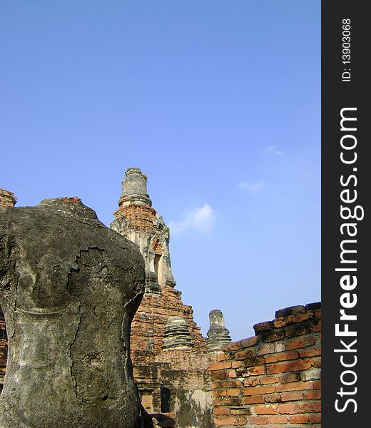 Headless Ruin Buddha and Ancient Pagoda in Ayutthaya, Thailand