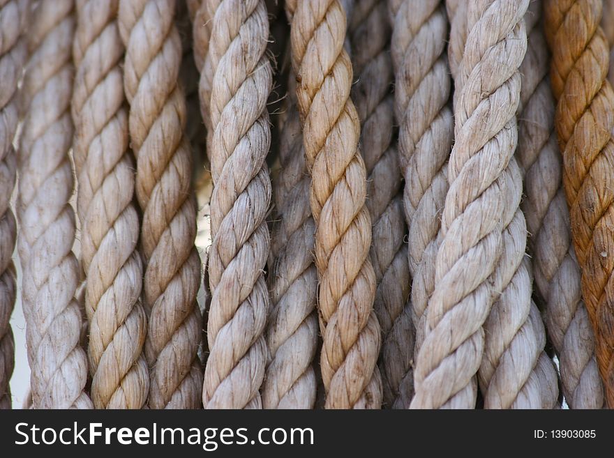 Several old ropes white and yellow. Several old ropes white and yellow